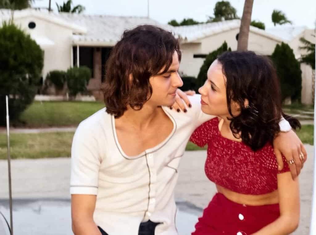 Young couple gazing at each other in a suburban neighborhood.